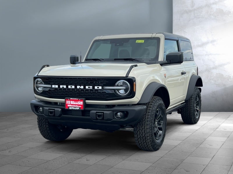 2026 Ford Bronco Badlands in Desert Sand — front three-quarter view